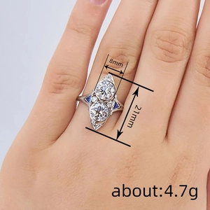 Art Deco style marquise ring with blue and white stones on female hand for a modern look