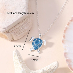 Detail showing sea turtle pendant with blue opal shell inlay and 45cm chain dimensions