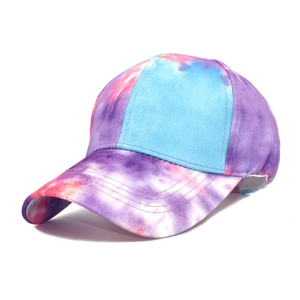 Detail of multi-color tie-dye baseball cap featuring back elastic adjustment strap