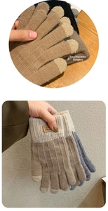 Close-up of touchscreen fingertips on warm knitted gloves with leather brand label