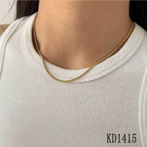 Elegant gold snake bone chain necklace for women with minimalist stainless steel design