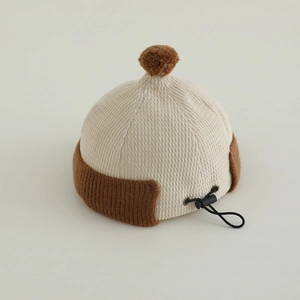Kids corduroy docker hat in beige and brown with adjustable drawstring and ear flaps