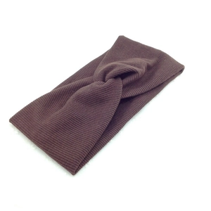Close-up of brown ribbed knit headband featuring a stylish center twist knot design