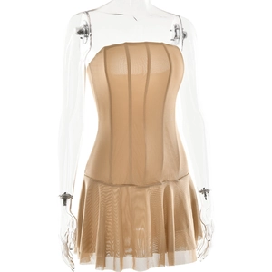 Detail of beige mesh tube dress featuring vertical ruching and pleated hemline on mannequin