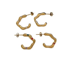 Golden C-shaped ripple earrings with white and multicolor crystal insets on white background