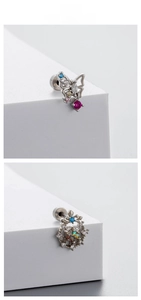 Macro shot of titanium steel butterfly and starburst earrings with colorful zircons