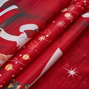 Macro view of Christmas fabric with Santa prints and high-quality textured weaving