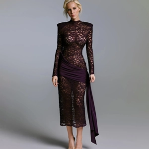Detail view of dark purple lace dress showing sheer texture and elegant draped fabric