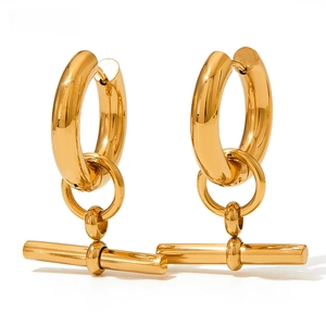 Macro view of gold T-bar pendant hoop earrings with highly polished stainless steel finish