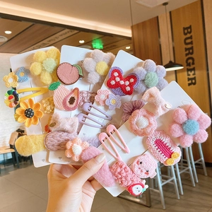 Charming set of colorful knitted and plush hair clips for girls in various floral patterns