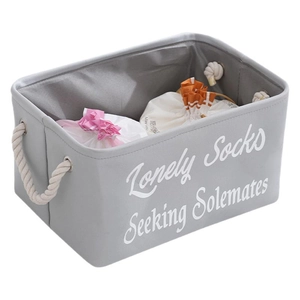 Grey fabric storage basket with cotton rope handles and Lonely Socks print