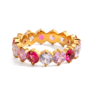 Detail of eternity ring with round cut colorful cubic zirconia in gold plating