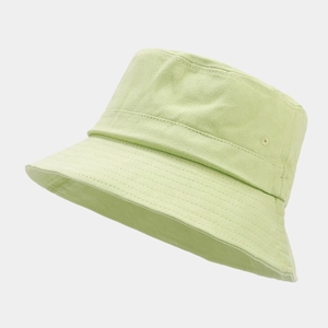Detail of light green cotton bucket hat with metal eyelets and reinforced stitching lines