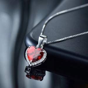 Elegant S925 sterling silver necklace featuring a red heart zircon pendant with halo diamonds