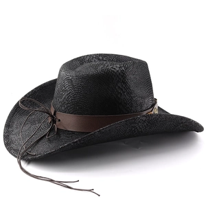 Detail of black cowboy hat featuring faux snakeskin texture and brown leather strap with logo