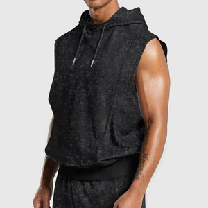 Detail of men's black acid wash sleeveless hoodie with textured knit fabric and slim fit design