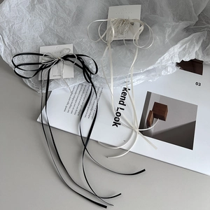 Handmade beaded bow hair clips with long ribbons in black and cream white colors