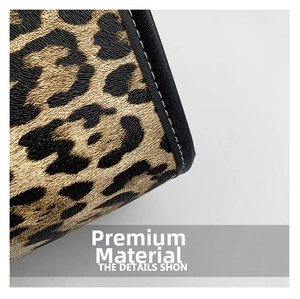 Detailed macro view of the leopard print texture and precise stitching on the tote bag