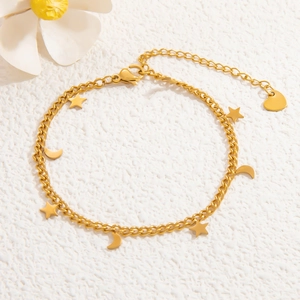 Detail of 18k gold plated stainless steel bracelet with star and moon charms
