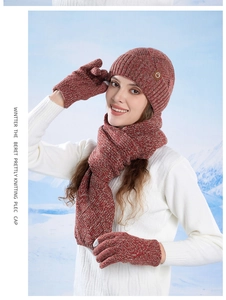 Detailed knit texture of red and brown winter set with beanie, scarf, and gloves