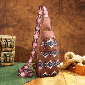 Aztec bohemian sling bag with geometric patterns and adjustable wide strap on vintage props