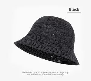Detailed texture of black breathable hollow-knit bucket hat with wavy brim design