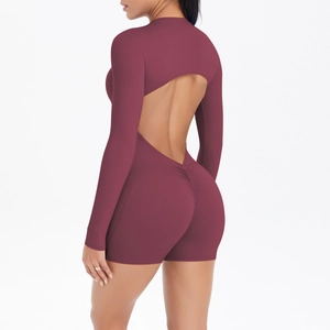 Detail of dark red cutout back and ruched peach butt design on sports yoga bodysuit