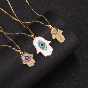 Gold Hamsa Hand necklaces with Evil Eye detail and zircon stones on black leather