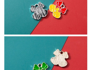 Detailed front and back views of alloy Christmas bell charms for DIY jewelry making