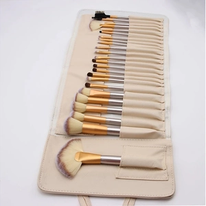Detail of 24pcs makeup brush set with purple bristles in beige PU leather wrap