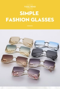Close-up of rimless square sunglasses with metallic heart detail and gradient lenses
