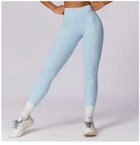 Detail showing high-waist band and seamless texture of light blue yoga leggings