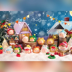 Close-up of festive Christmas-themed blind box figurines in a snow village scene