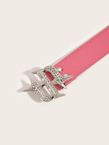 Detail of a pink PU leather belt featuring a silver dollar sign buckle with rhinestones