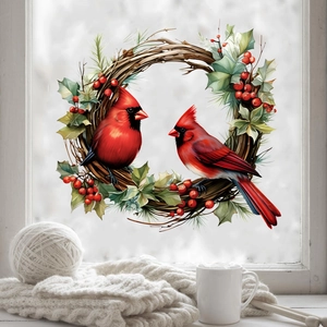 Christmas window sticker featuring red cardinal birds with festive holly and berry wreath