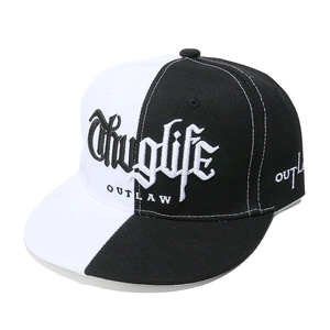 Detail of Thuglife embroidery on a black and white split flat brim snapback cap