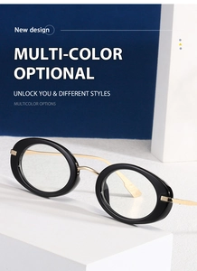 Detail view of oval y2k sunglasses with black frames and gold metal temples