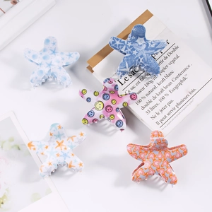 Blue starfish hair clips with smiley patterns in minimalist cute cartoon style for women