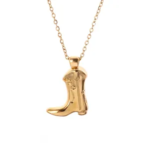 Classic gold cowboy boot pendant necklace with detailed wrinkles on a fine link chain