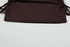Detailed view of dark coffee ribbed fabric featuring drawstrings and flat hem stitching