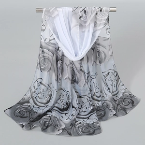 Detail of floral peony print on lightweight chiffon scarf in elegant grayscale