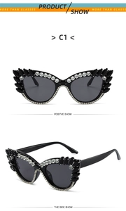 Detail showing vintage cat eye frame with white crystals and black teardrop stones