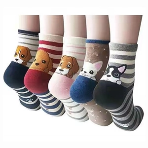 Detail showing five pairs of colorful women's cotton socks with cute cartoon dog patterns