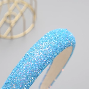 Sparkly blue glitter wide headband for women featuring iridescent sequins and fabric lining