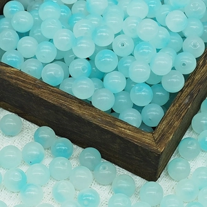 Macro shot of 10mm blue and white gradient round glass beads for DIY jewelry making