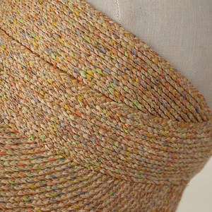Macro view of multi-color woven raffia texture and colorful braided fibers detail