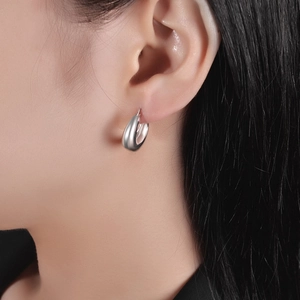 Minimalist silver-tone geometric drop earrings shown on model for a trendy style