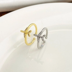 Minimalist airplane ring set in gold and silver finish with sparkling crystal stones