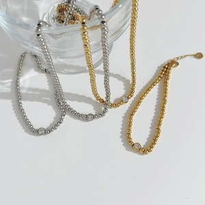 Elegant bead chain necklace with single zircon pendant in gold and silver finish