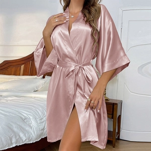 Elegant pink satin tie-waist robe for women featuring smooth silk texture and kimono sleeves